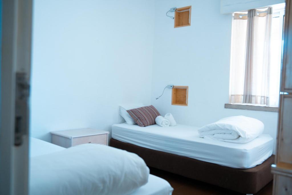 Postel nebo postele na pokoji v ubytování Wax Hostel