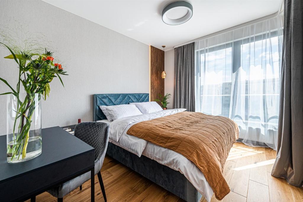 Posteľ alebo postele v izbe v ubytovaní Plac Unii Apartament Gdynia