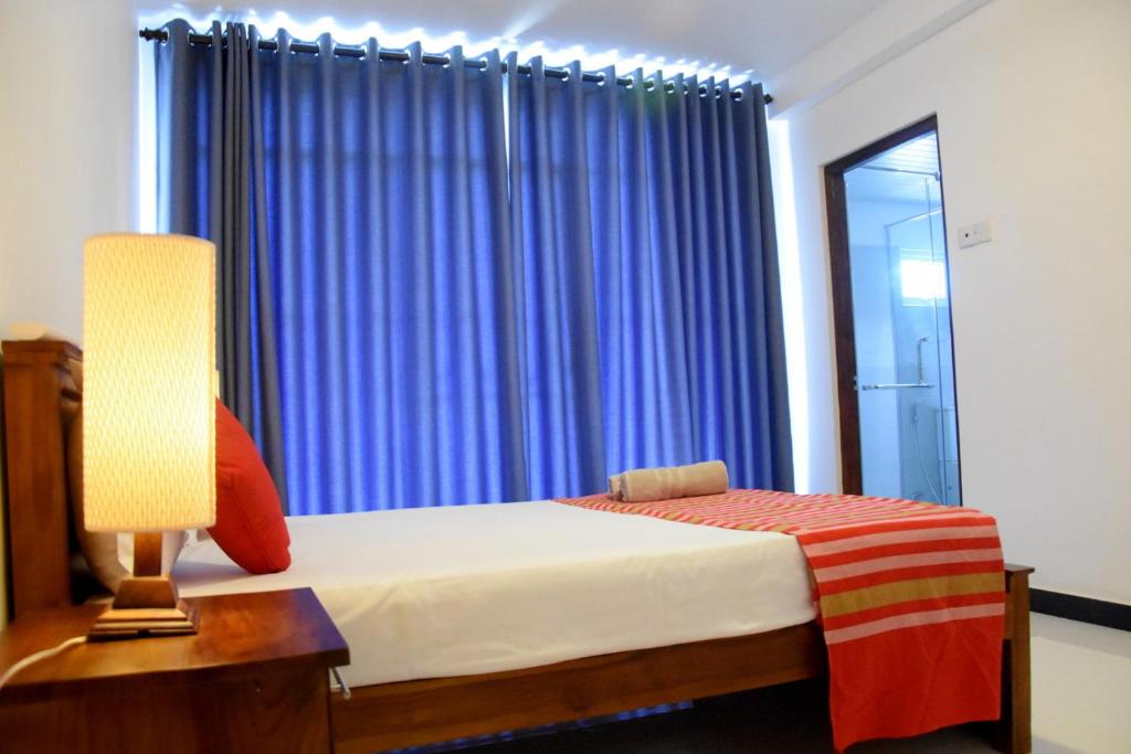 Postel nebo postele na pokoji v ubytování Cozy Homestay Kandy