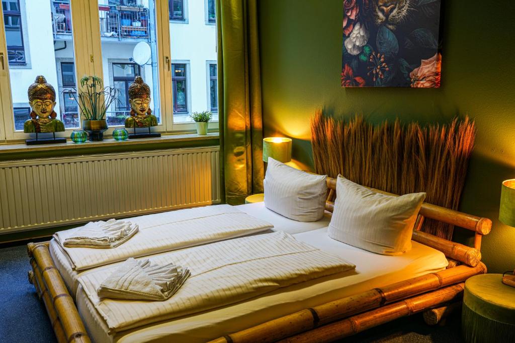 Postel nebo postele na pokoji v ubytování LaLeLu Hostel Dresden
