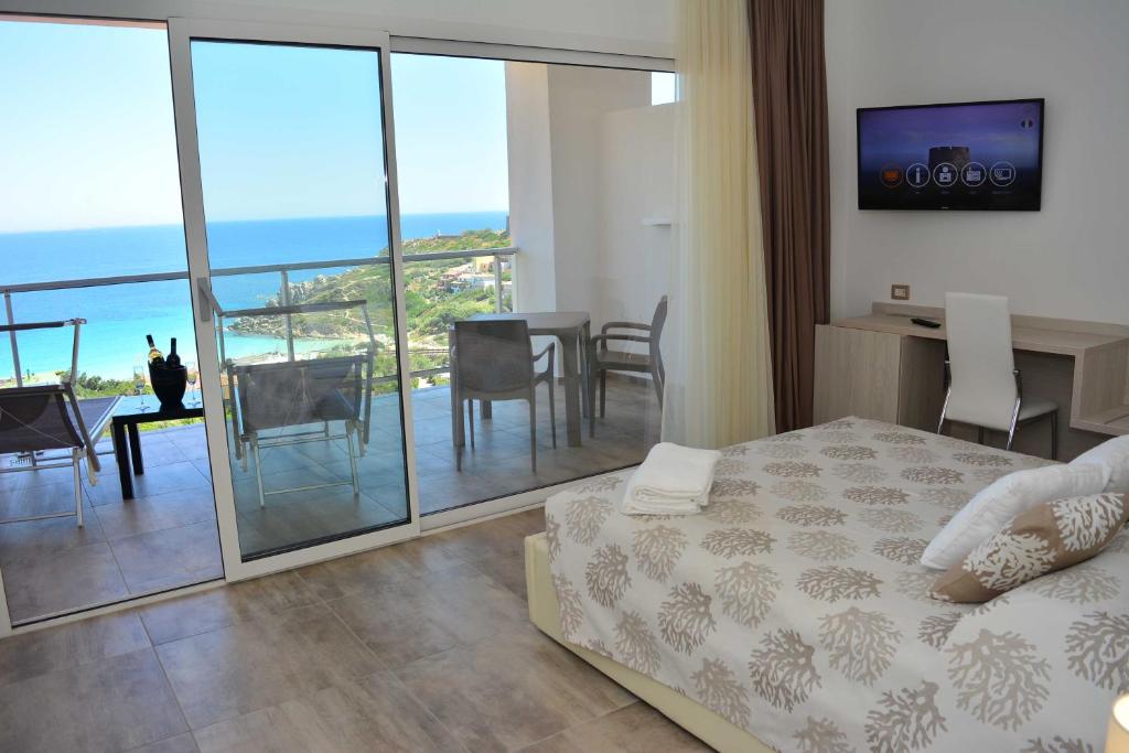 Postel nebo postele na pokoji v ubytování Hotel La Contessa