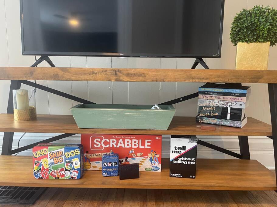 a shelf with a television and some snacks on it at Fancy Homes Manistee B with Lake View! in Manistee