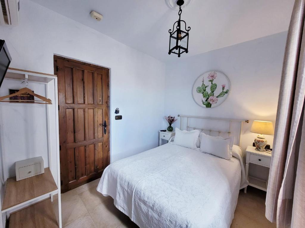 Cama o camas de una habitación en Hospedería El Caravansar
