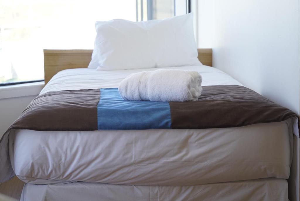 Postel nebo postele na pokoji v ubytování Hostal Doble E Patagonia