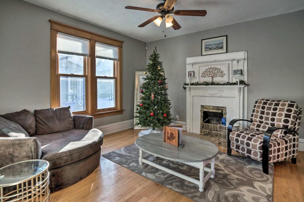 a living room with a christmas tree and a couch at Saint Paul Home in Historic Cathedral Hill in Saint Paul