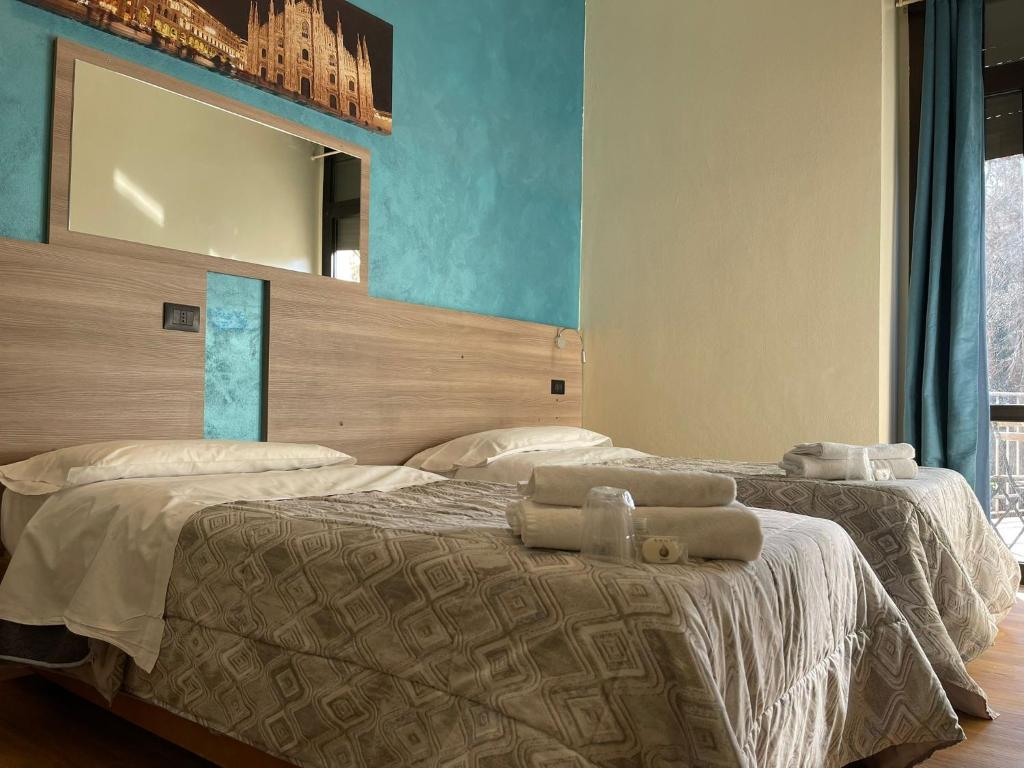 Postel nebo postele na pokoji v ubytování Hotel 26