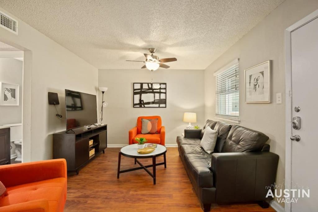 a living room with a couch and a table at Austin East Side on Manor Rd in Austin