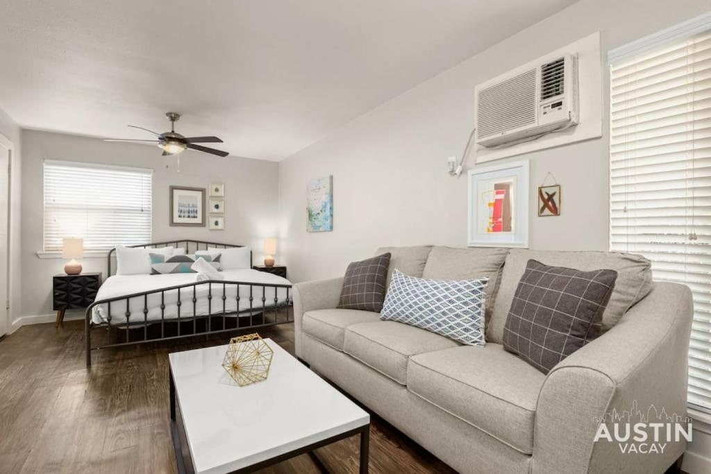 a living room with a couch and a table at Walk To Zilker King Bed Pool Free Parking in Austin