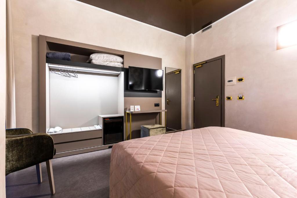Televízia a/alebo spoločenská miestnosť v ubytovaní Hotel Dei Nani