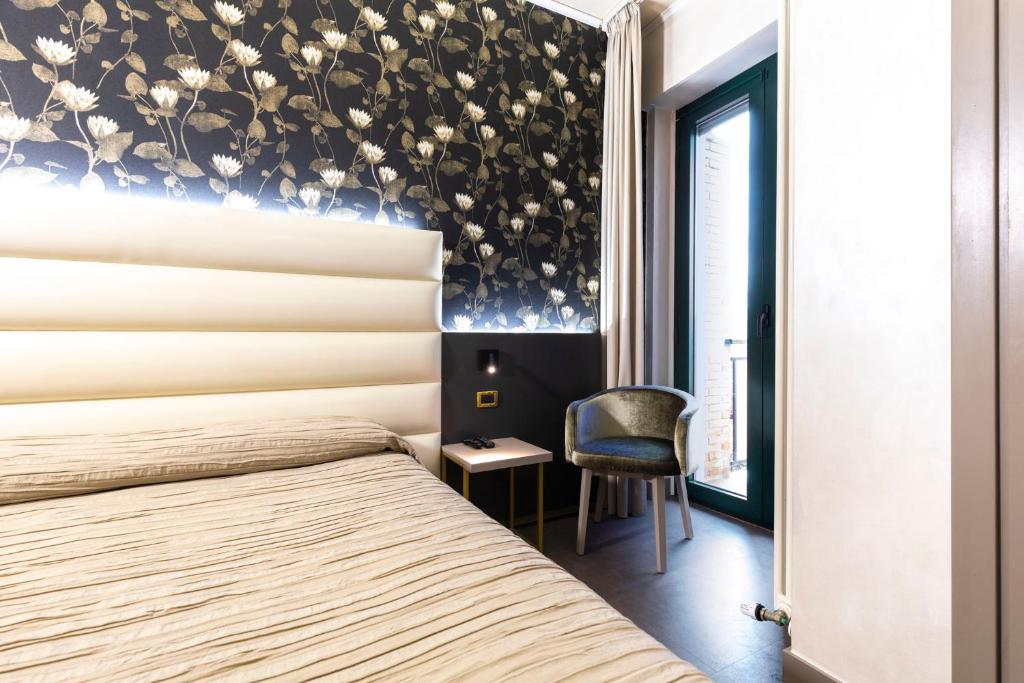 Posteľ alebo postele v izbe v ubytovaní Hotel Dei Nani