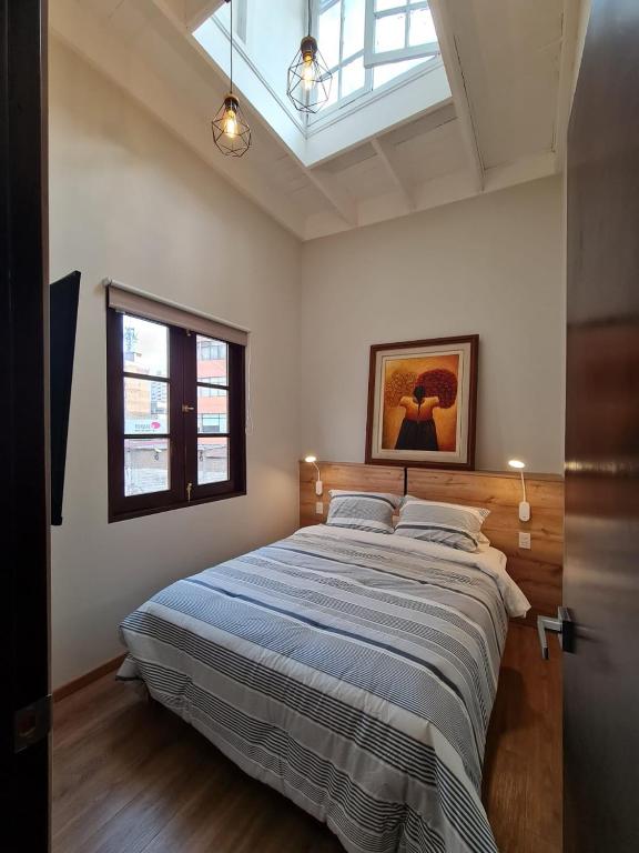 Postel nebo postele na pokoji v ubytování Flying Dog Lima B&B