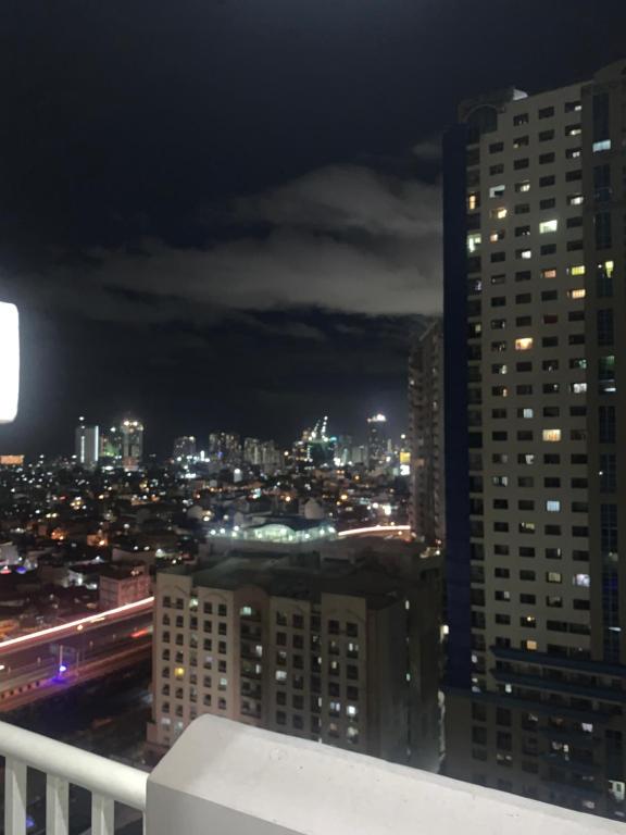 a view of a city skyline at night at Laureano Trevi Residences Makati Suites Condotel in Manila