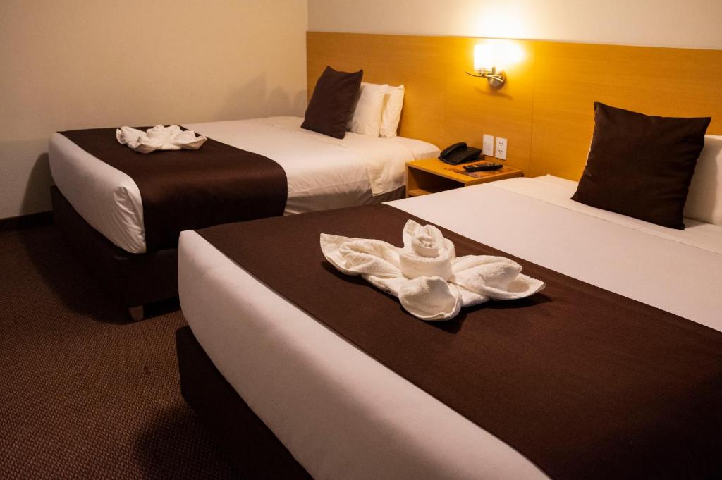 Postel nebo postele na pokoji v ubytování Casona Plaza Balsa Inn