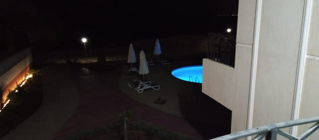 a view of a swimming pool at night at Doudy in Sharm El Sheikh