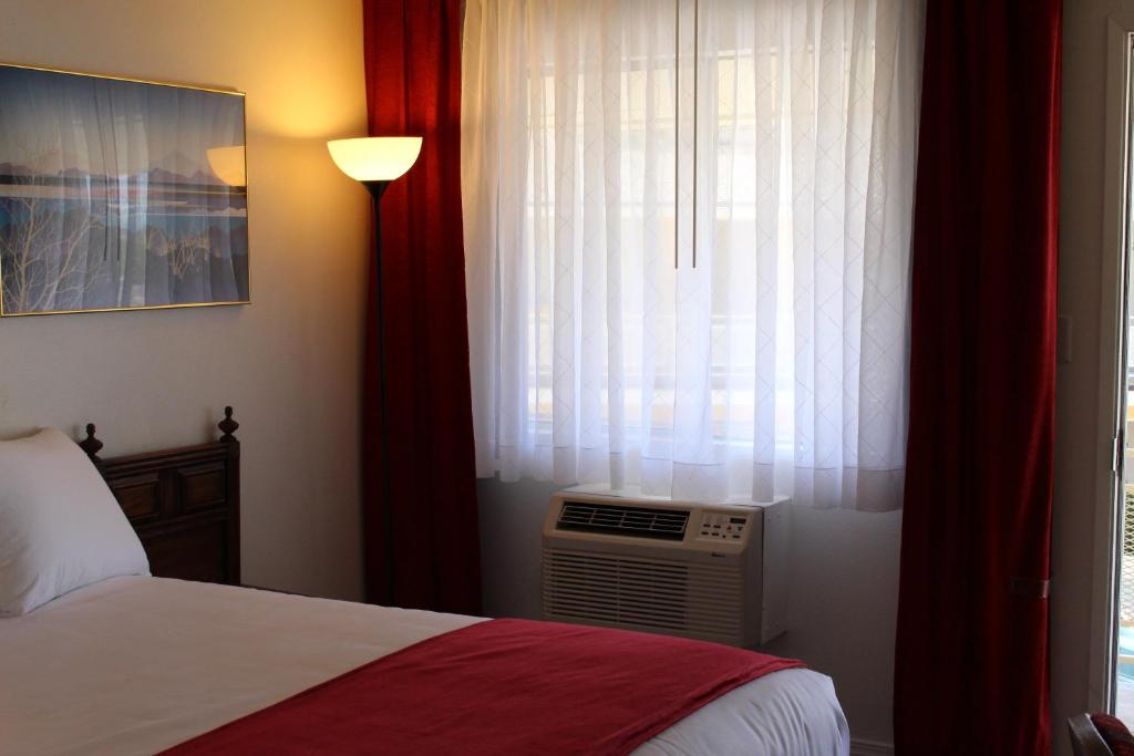 Postel nebo postele na pokoji v ubytování Sovana Inn