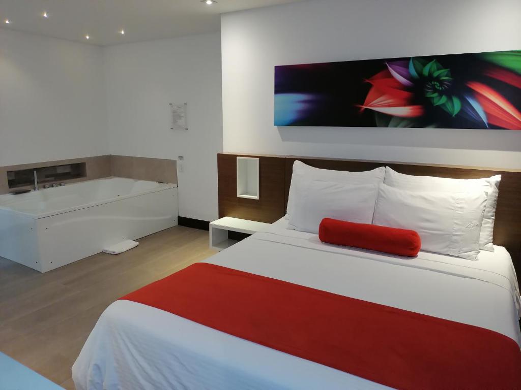 Postel nebo postele na pokoji v ubytování Hotel Loyds