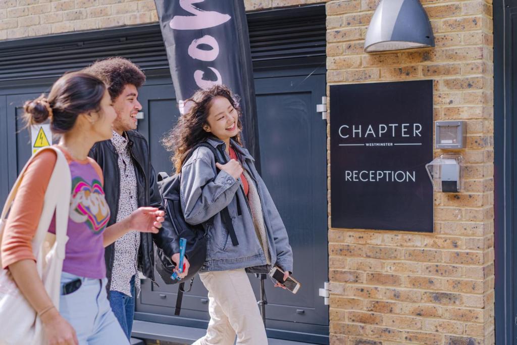 a group of people walking down the street at Premium Studios at Chapter Westminster in London minutes away from The Big Ben in London