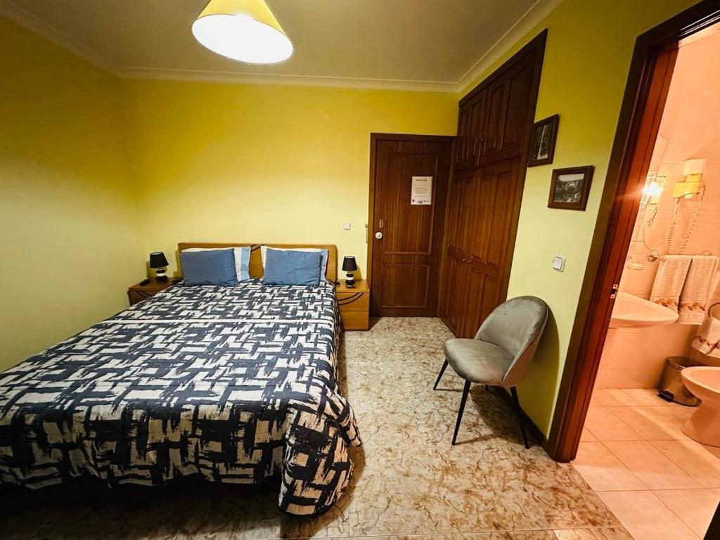 Postel nebo postele na pokoji v ubytování Residência Iris
