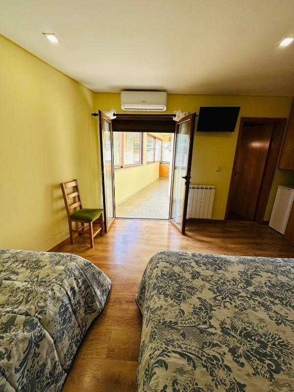 Postel nebo postele na pokoji v ubytování Residência Iris