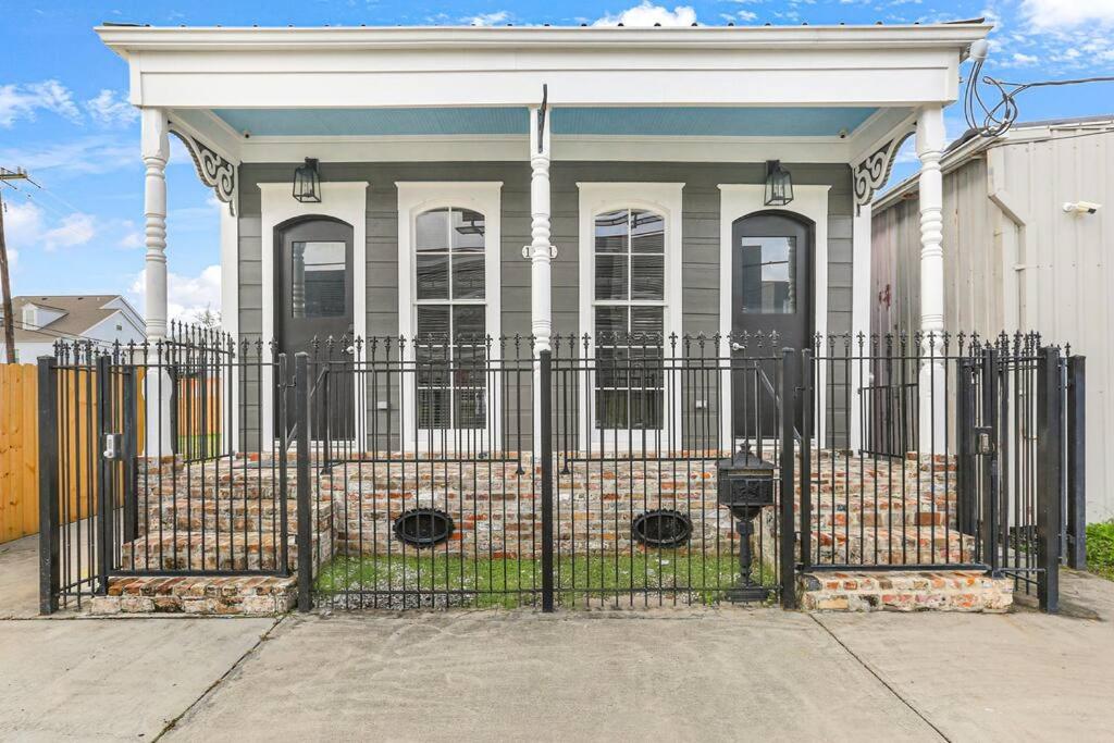 a house with a gate in front of it at Sleep 10 next to Superdome and downtown in New Orleans