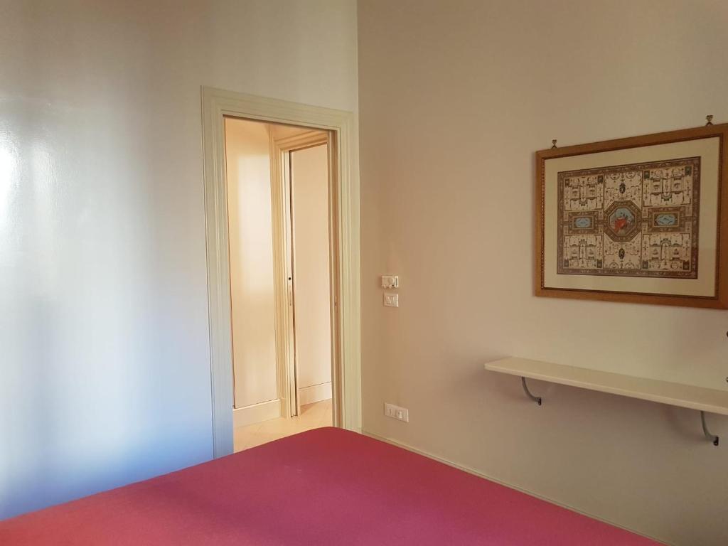 A bed or beds in a room at Popolo square deluxe flat