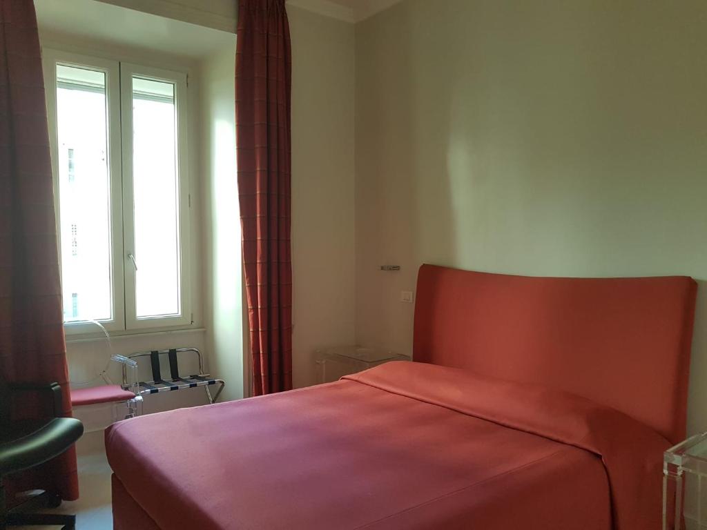A bed or beds in a room at Popolo square deluxe flat