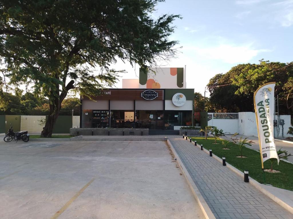 a parking lot in front of a building at Pousada Primavera in Parnaíba