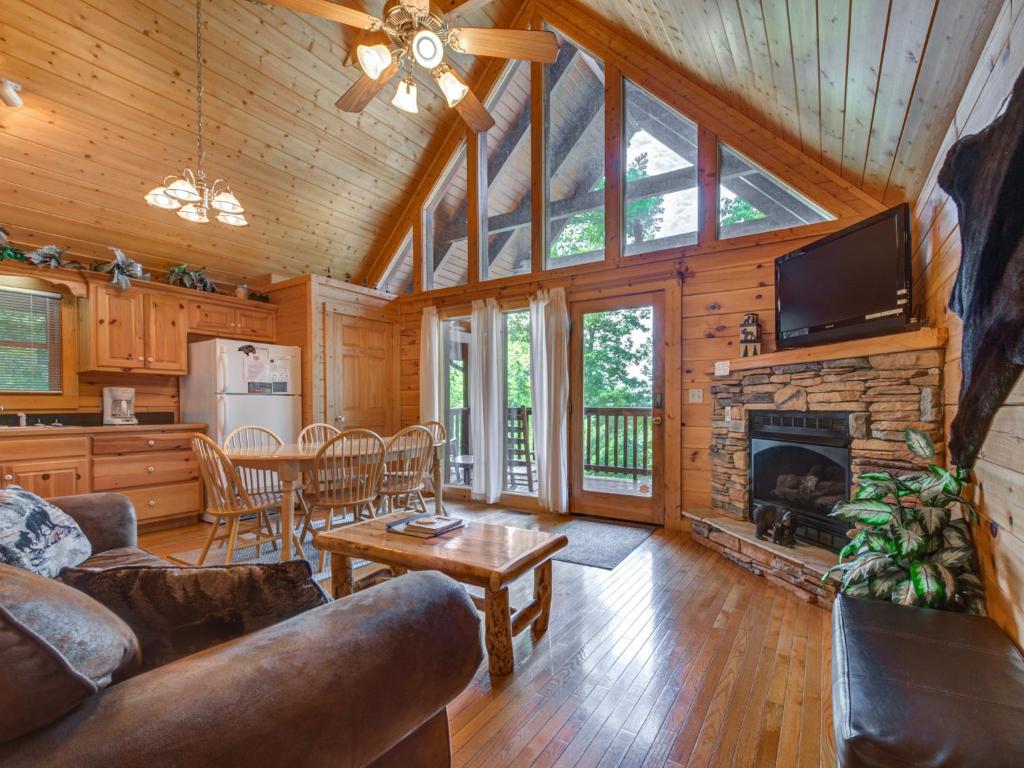 a living room with a couch and a fireplace at Trail’s End, 2 Bedrooms, Hot Tub, Jetted Tub, Gas Fireplace, Sleeps 8 in Gatlinburg