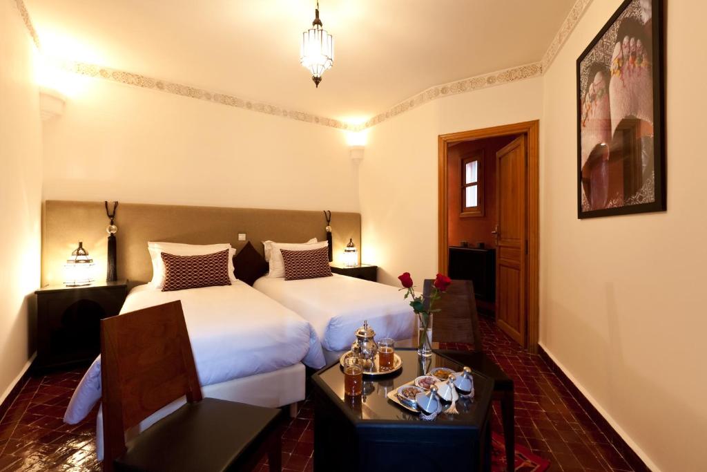Postel nebo postele na pokoji v ubytování Hotel & Spa Riad El Walaa