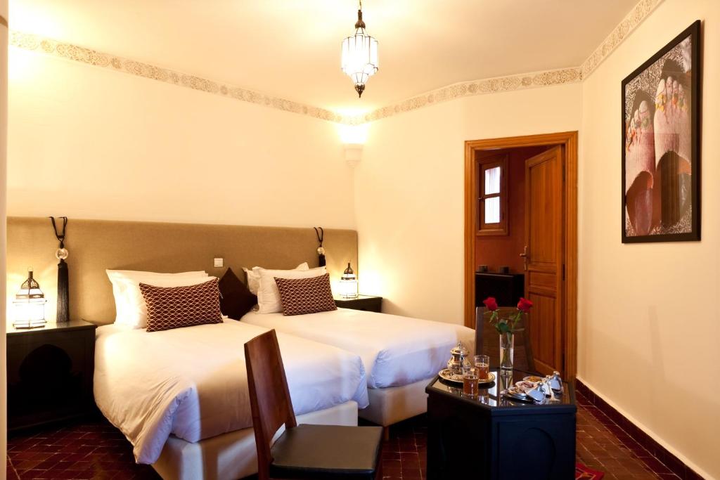 Postel nebo postele na pokoji v ubytování Hotel & Spa Riad El Walaa