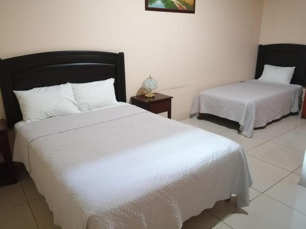 Katil atau katil-katil dalam bilik di Hotel La Guaria