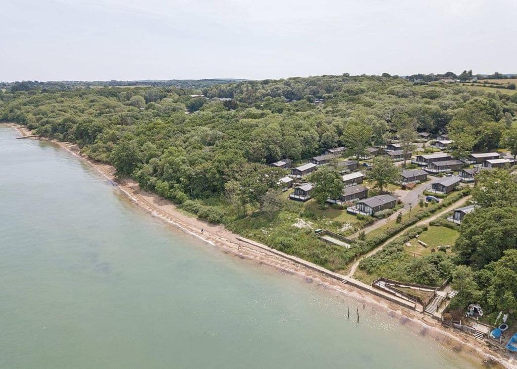 an aerial view of a resort next to a body of water at Woodside Coastal Retreat in Ryde