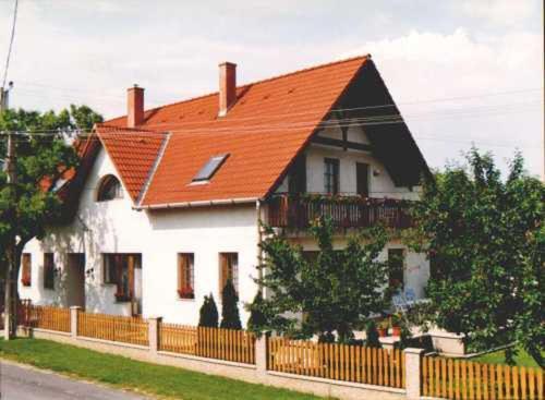 a large white house with an orange roof at Zsuzsa Panzió in Balatonfüred