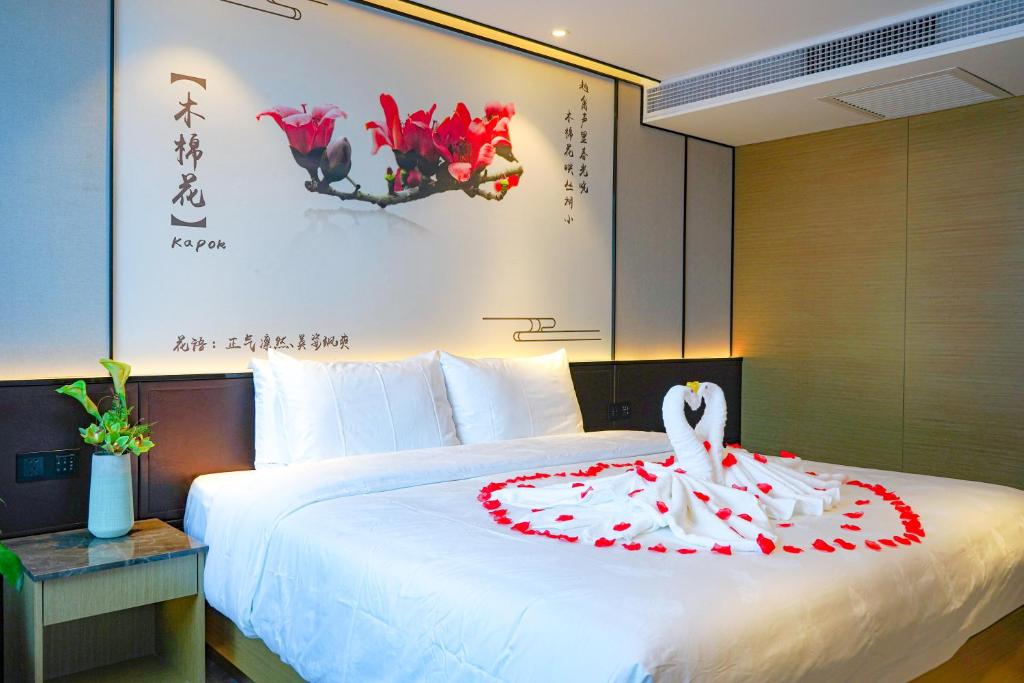 Postel nebo postele na pokoji v ubytování Guangdong Baiyun City Hotel