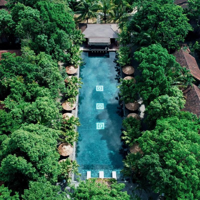 an aerial view of a swimming pool with trees at Pilgrimage Village Boutique Resort & Spa in Hue