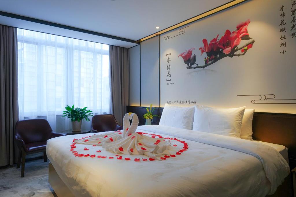 Postel nebo postele na pokoji v ubytování Guangdong Baiyun City Hotel