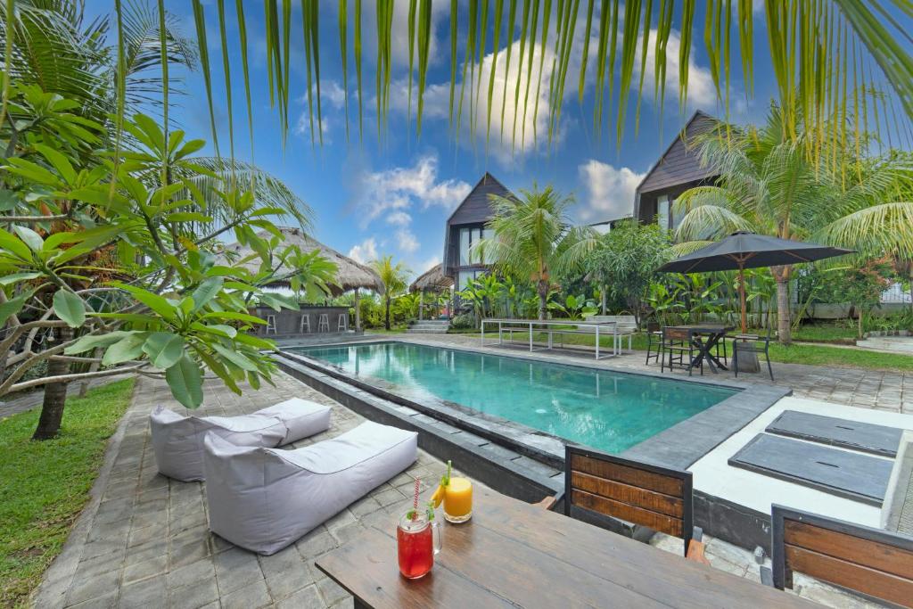 an image of a villa with a swimming pool at BB Garden Resort in Canggu
