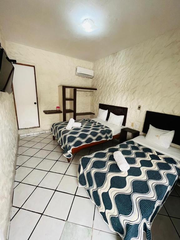 Postel nebo postele na pokoji v ubytování Hotel Playa de Oro - Enfrente de WTC y Plazas Comerciales