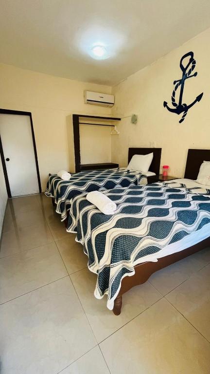 Postel nebo postele na pokoji v ubytování Hotel Playa de Oro - Enfrente de WTC y Plazas Comerciales