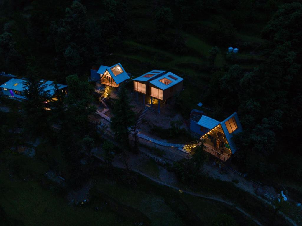 an overhead view of a house with blue roofs at Stargazing Cottages Jibhi in Jibhi