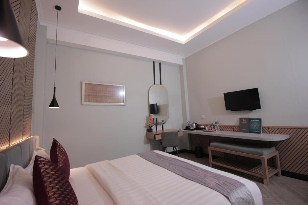 TV a/nebo společenská místnost v ubytování Muara Hotel Bukittinggi