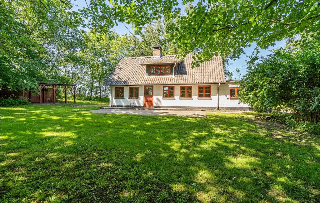 a house with a large yard in front of it at Cozy Home In Nrre Nebel With Wifi in Nørre Nebel