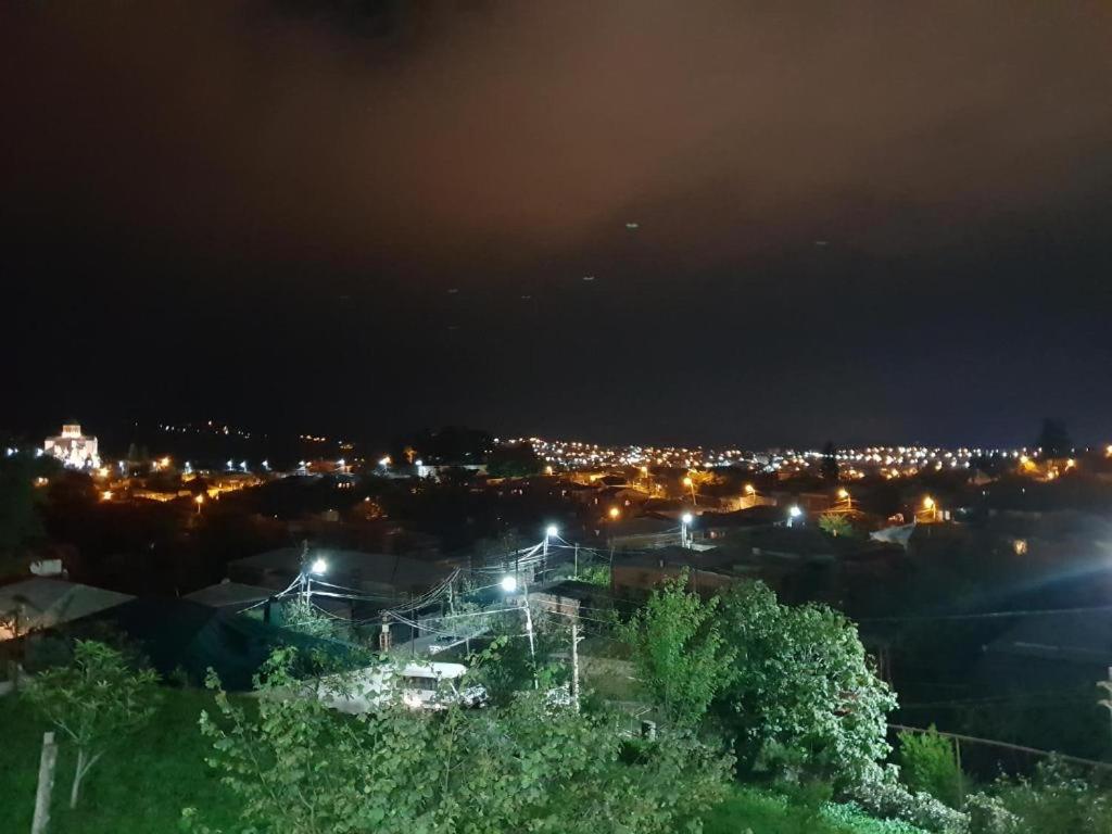 a view of a city at night with lights at Hotel 9th Sky in Kutaisi