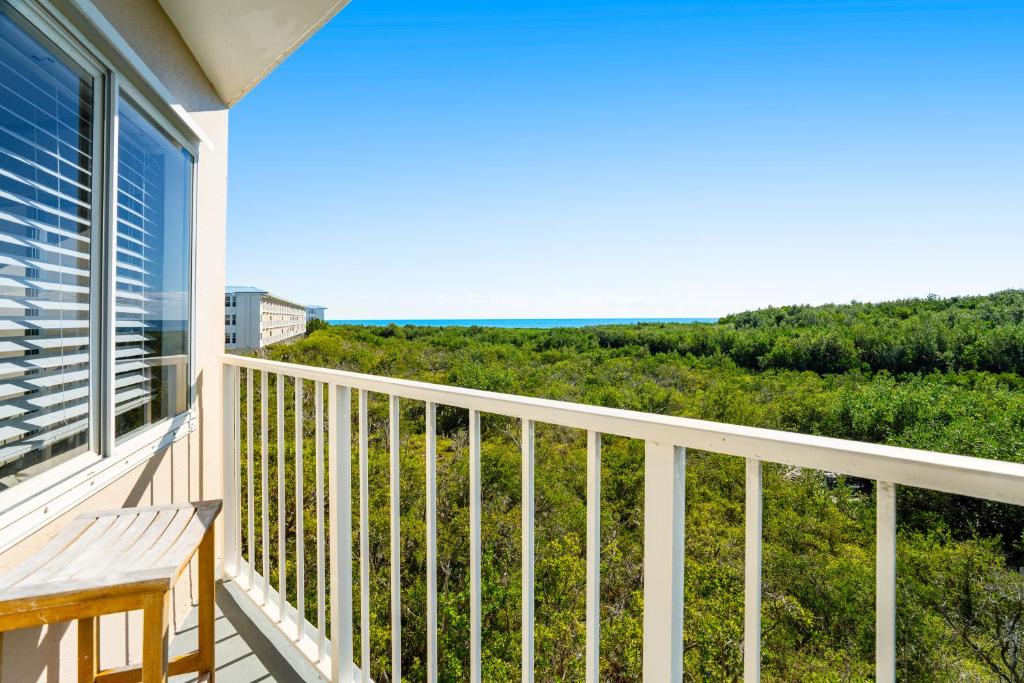 a balcony with a view of the ocean at Nauti Hideaway, Unit #2314 in Tavernier