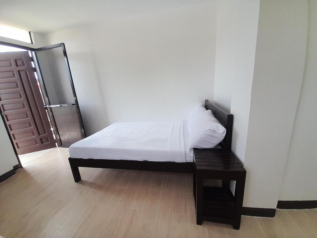 Postel nebo postele na pokoji v ubytování Palawan Residence