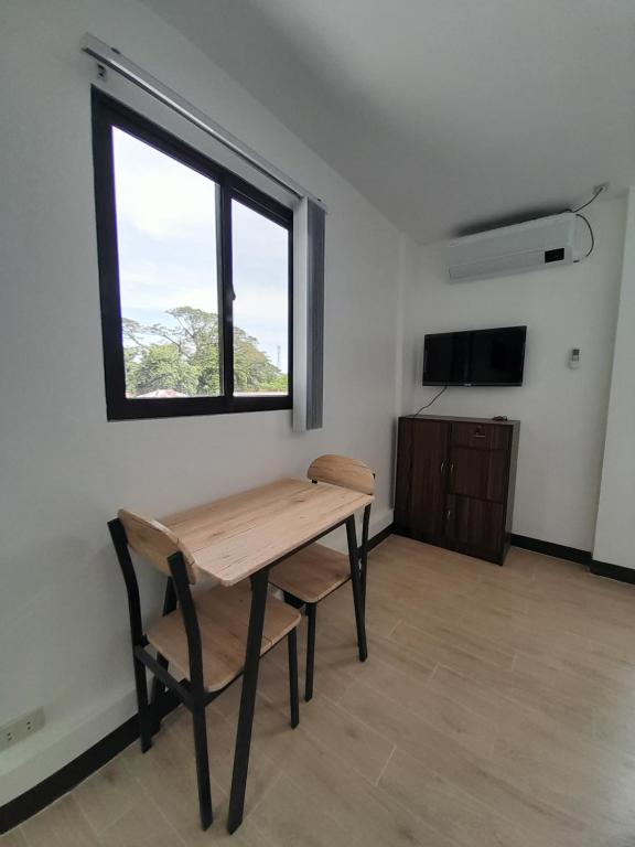 TV a/nebo společenská místnost v ubytování Palawan Residence