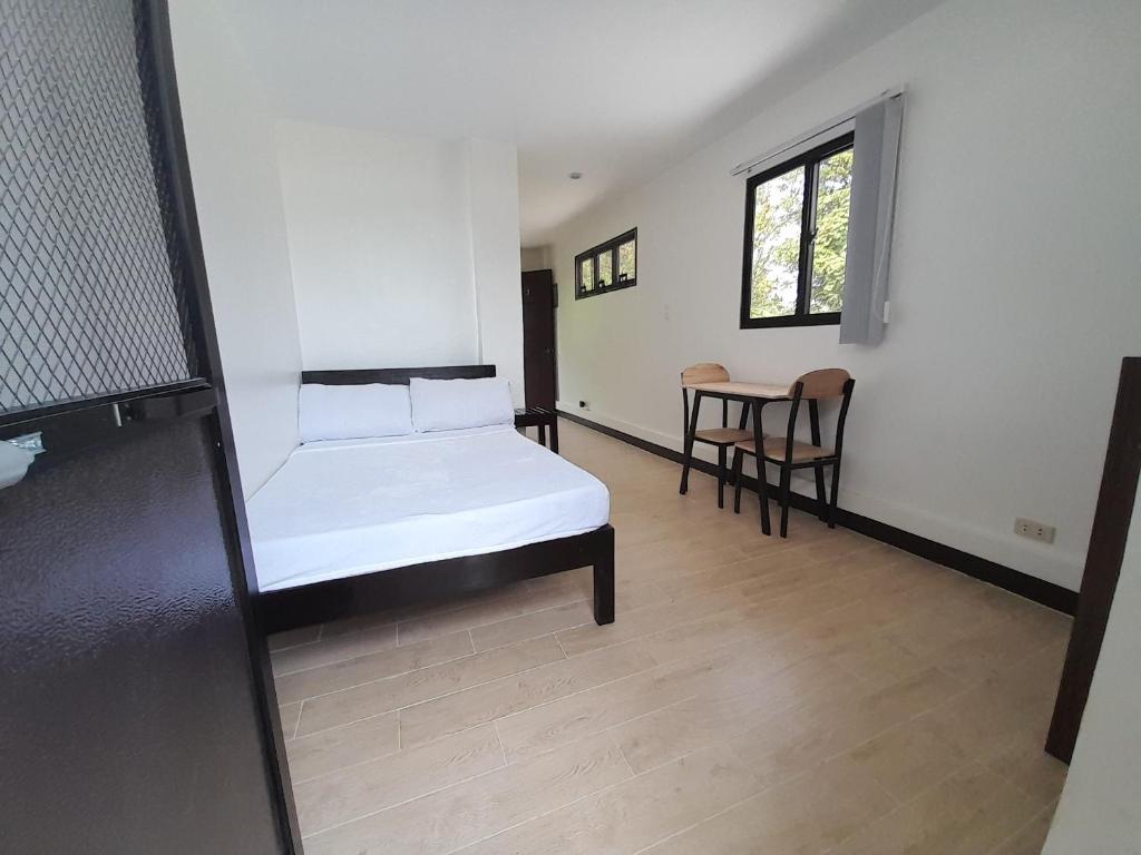 Postel nebo postele na pokoji v ubytování Palawan Residence