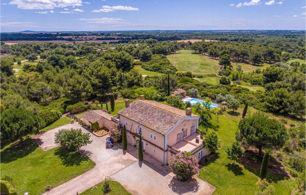 an aerial view of a house with a garden at Gorgeous Home In Bziers With Swimming Pool in Montblanc