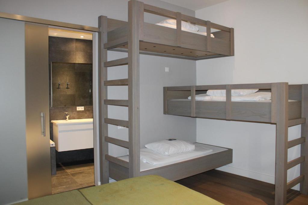Een bed of bedden in een kamer bij Hotel 't Peperhuys