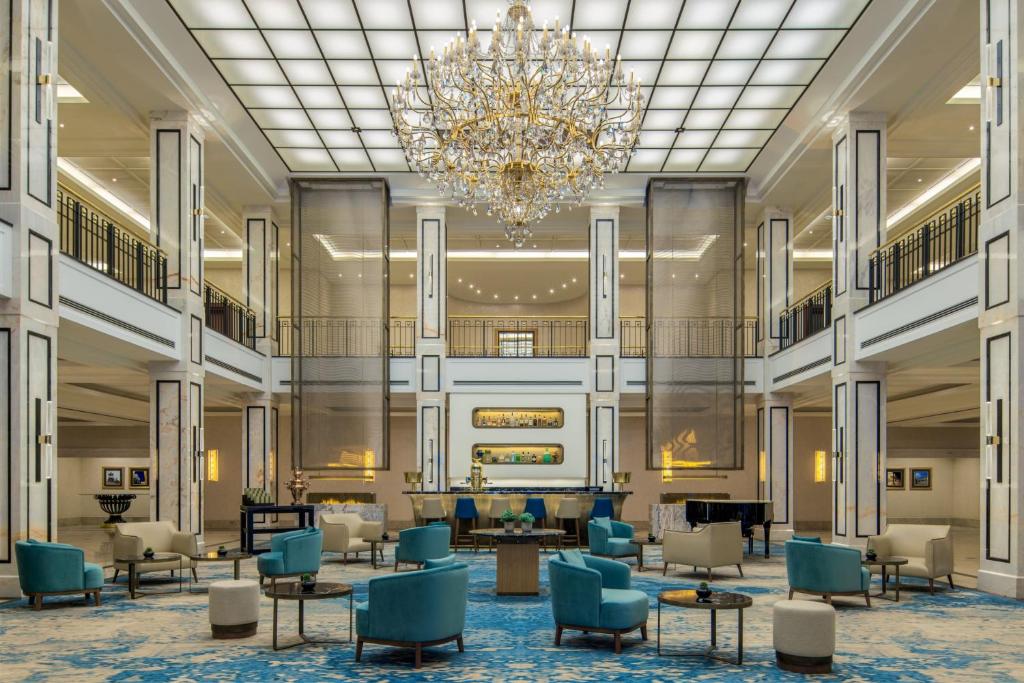 a rendering of the lobby of a hotel with a chandelier at JW Marriott Hotel Berlin in Berlin